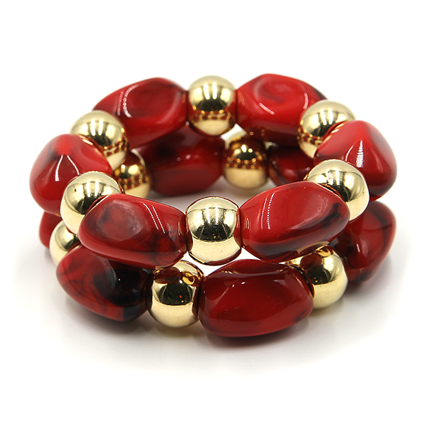 Two piece marbled oval bead stretch bracelet with gold tone accents.