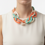 Colorful necklace on a mannequin bust against a white background