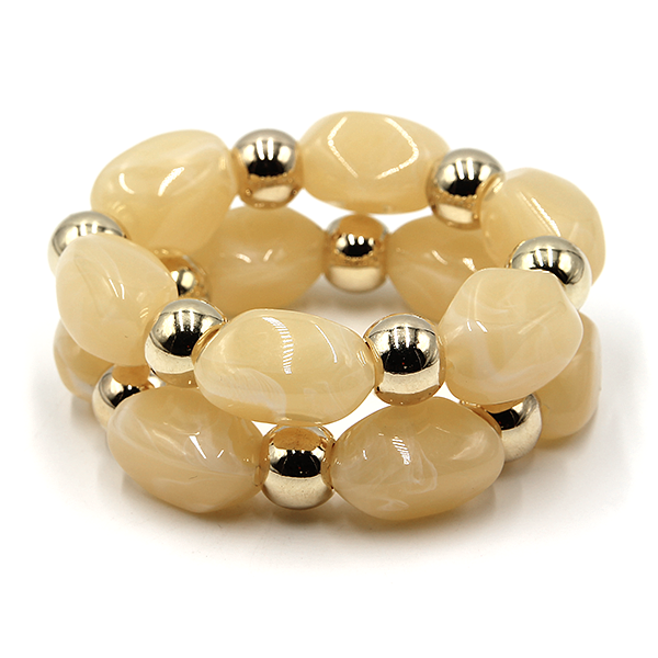 Two piece marbled oval bead stretch bracelet with gold tone accents.