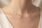 Necklace with floral design on a 'Charmed' branded card