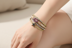 Multistrand bracelet with star and lip design charm on a white background